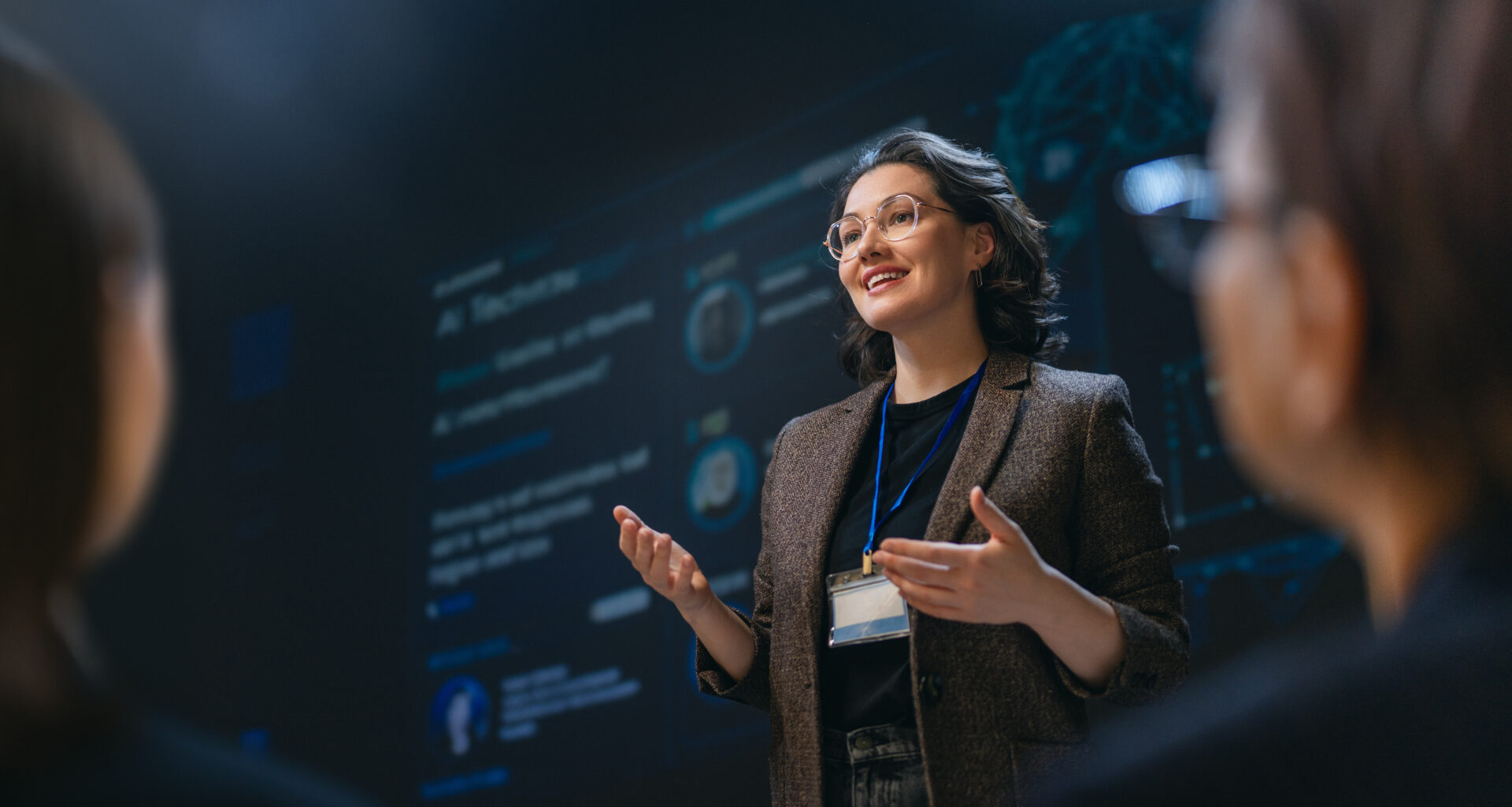 A charismatic businesswoman delivers a dynamic and engaging presentation on technology in a modern conference room, inspiring her audience with leadership and knowledge. The atmosphere is professional, empowering, and filled with anticipation for groundbreaking ideas.