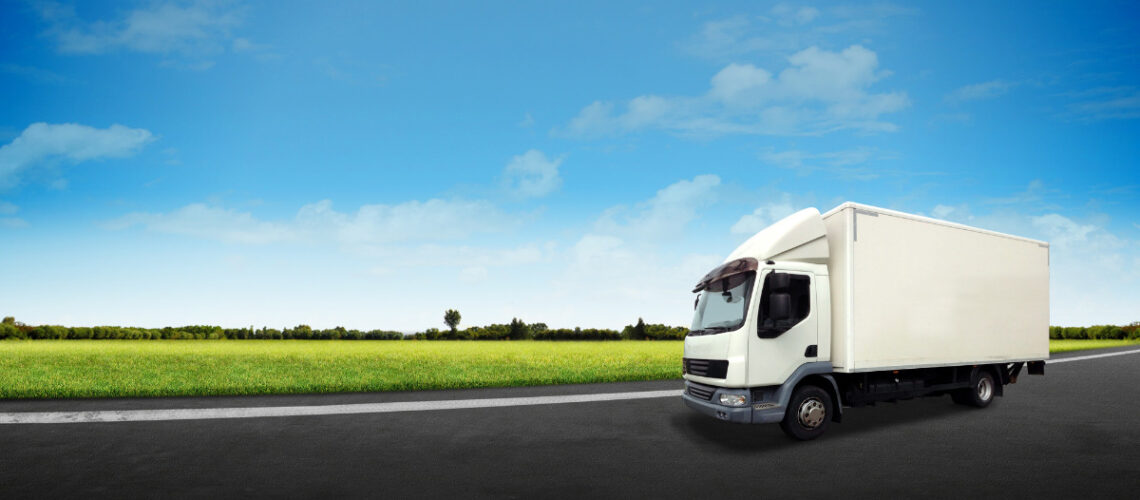White delivery van and blue sky