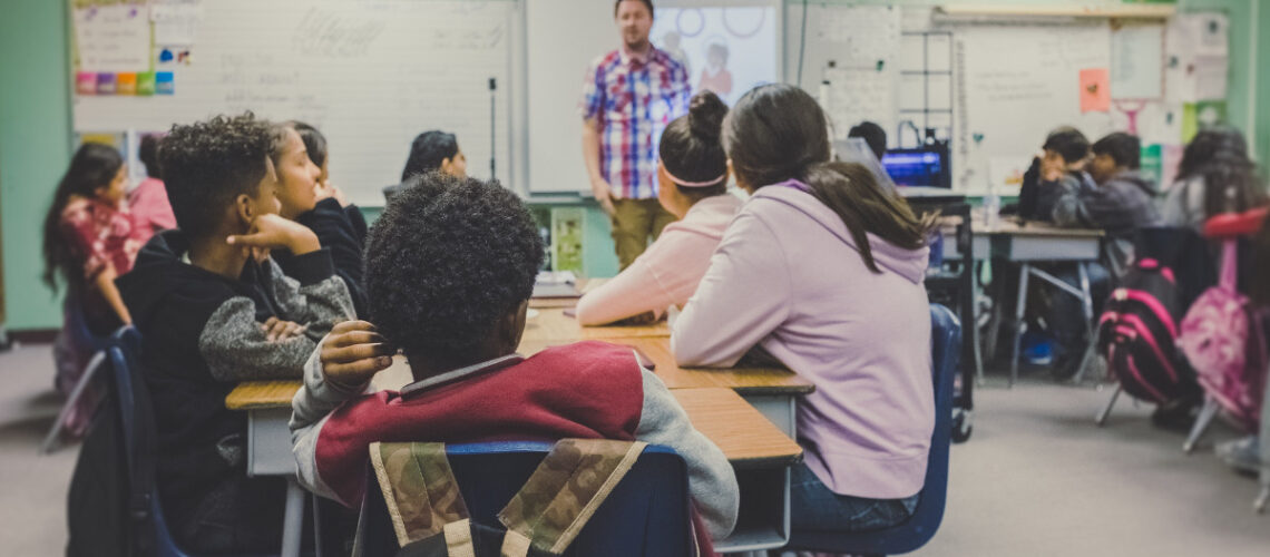 children and teacher in a classroom